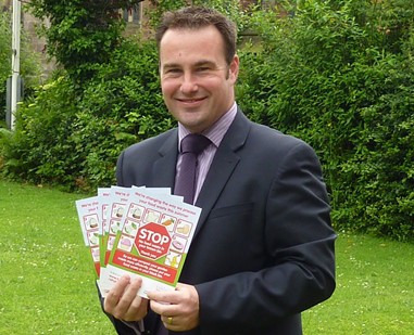 Lichfield councillor Iain Eadie with leaflets urging residents to stop putting food waste in with their garden waste